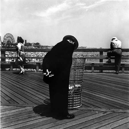 Man Looking in Waste Basket