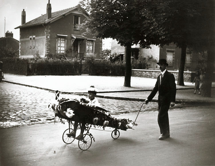 Robert Doisneau, Concours de Chars Fleuris, Choisy le Roi (Man and Boy in Flower Decorated Airplane), Silver print, 6-3/4 x 8-3/4 in, 1934/1960c